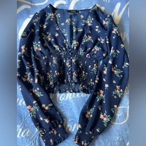 Blue floral cropped blouse.